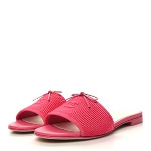 CHANEL
Fabric Embroidered CC Bow Mules
Dark Pink